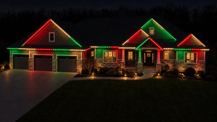 The same home with the roofline running red, warm white and green in long blocks